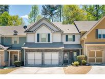 Charming townhome featuring a two-car garage and welcoming front entrance at 971 Brownstone Ln # 18, Marietta, GA 30008