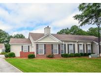 Charming single-story home with brick accents, manicured lawn, and inviting curb appeal at 167 Camry Ln, Grayson, GA 30017