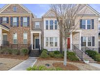 Charming townhome featuring well-maintained landscaping and a welcoming entryway at 1292 Park Bench Pl, Mableton, GA 30126