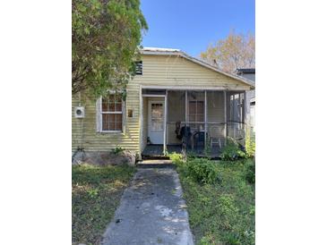 Yellow single story home with screened porch at 431 N Hanover St, Charleston, SC 29403