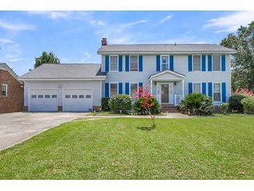 Two-story house with blue shutters, attached garage, and well-manicured lawn at 13 Charlyn Dr, Charleston, SC 29407