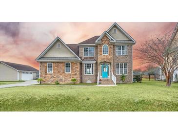 Two-story house with stone accents and a teal front door at 1713 Pimlico Blvd, Moncks Corner, SC 29461