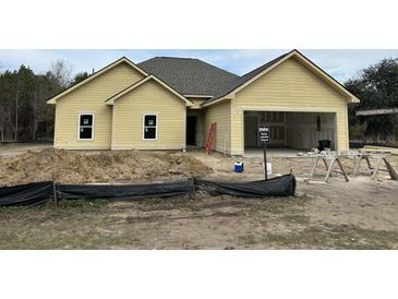 Newly constructed craftsman style home with attached garage at 1081 Irving Manigault Rd, McClellanville, SC 29458