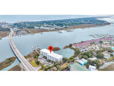 Aerial view showing building location near waterway and bridge at 2395 Folly Road Rd # 4F, Folly Beach, SC 29439