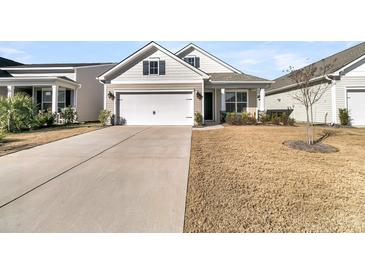 Two-story Craftsman home with a large driveway and landscaped yard at 119 Leeward Lndg, Summerville, SC 29486