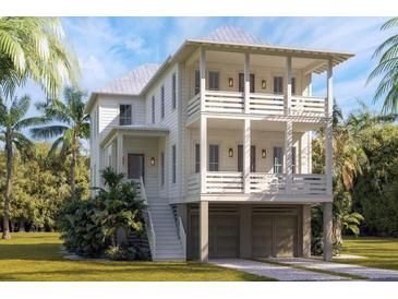 Two-story home with double garage and front porch at 9005 Stern Aly, Johns Island, SC 29455