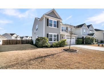 Two-story house with gray siding, white trim, and a two-car garage at 9736 Black Willow Ln, Ladson, SC 29456