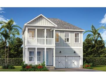 Two-story home with gray siding, white trim, and a two-car garage at 350 Trailmore Ln, Summerville, SC 29486