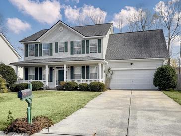 Two-story house with green shutters, white siding, and a two-car garage at 173 Hainsworth Dr, North Charleston, SC 29418