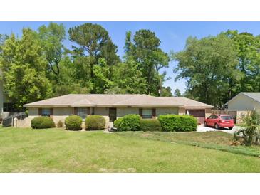 Brick ranch home with spacious yard and mature trees at 230 Smythe Dr, Summerville, SC 29485