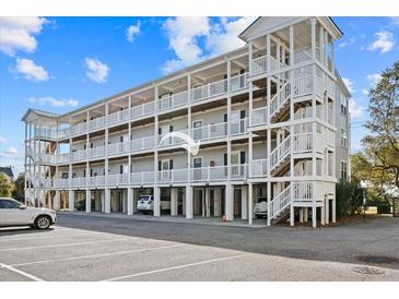 Three-story building with multiple balconies and parking at 2262 Folly Rd # 2-K, Charleston, SC 29412
