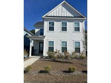 Two-story white house with a black front door and landscaping at 106 Helena Park Dr Dr, Summerville, SC 29486