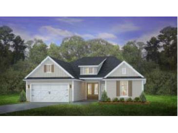 Two-story craftsman style home with a large front yard, white trim and gray siding at 207 Bilge Rd, Ridgeville, SC 29472