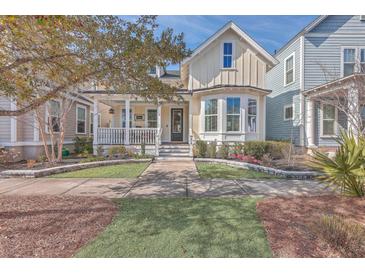 Charming craftsman style home with a welcoming front porch and manicured landscaping at 216 Bumble Way, Summerville, SC 29485