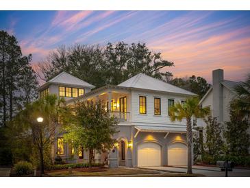 Two-story home with white siding, gray accents, and a three-car garage at 341 Bridgetown Pass, Mount Pleasant, SC 29464