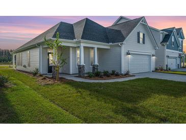 Two-story Craftsman home with a covered porch and attached two-car garage at 115 Crosscut Ln, Summerville, SC 29486