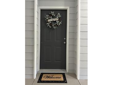 Inviting front door with a welcome wreath and mat at 1300 Park West Blvd # 110, Mount Pleasant, SC 29466