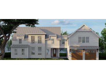 Two-story farmhouse with metal roof, two-car garage, and landscaping at 420 Greenwich St, Mount Pleasant, SC 29464