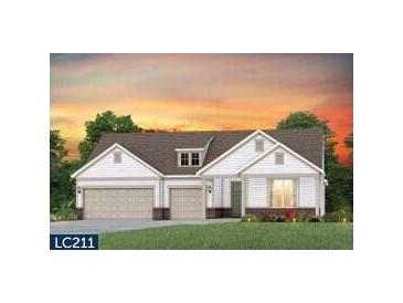 Two-story home with attached garage and landscaped lawn at 533 Pink Lily Lane, Summerville, SC 29486
