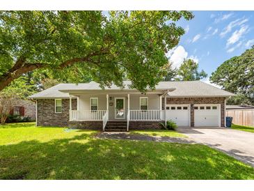 Brick ranch house with attached garage and covered porch at 445 Parkdale Dr, Charleston, SC 29414