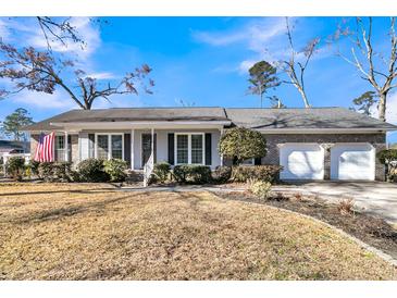 Brick ranch house with attached two-car garage and landscaped lawn at 211 Brailsford Rd, Summerville, SC 29485