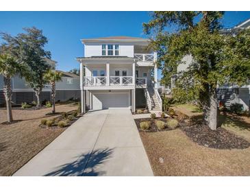 Two-story home with white siding, balcony, and attached garage at 2270 Tillage St, Mount Pleasant, SC 29466