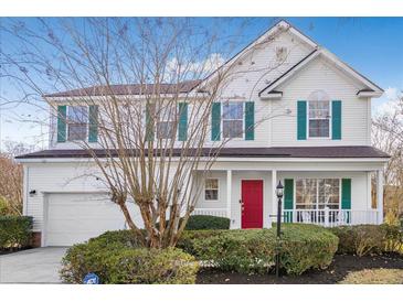 Two story house with white siding, red door, and green shutters at 1014 Ariel Ct, Summerville, SC 29485