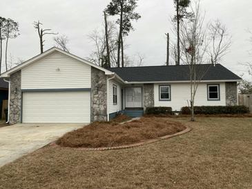 House exterior with a two-car garage and landscaping at 148 Ponderosa Dr, Ladson, SC 29456