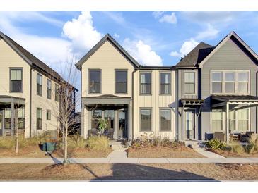 Cream and gray two-story townhouses with front porches and landscaping at 157 Pocket Bend Cir # B, Summerville, SC 29486