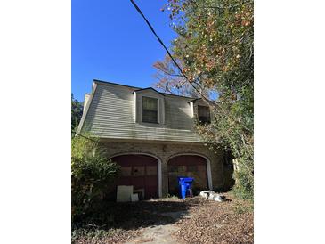 Brick ranch home with attached garage needing repairs at 4328 Helene Dr, North Charleston, SC 29418