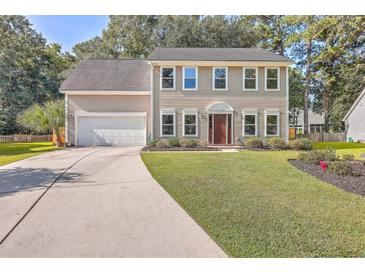 Two-story house with a neutral exterior, landscaped lawn, and driveway at 602 Leaning Pin Ct, Summerville, SC 29485