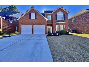 Brick two-story house with a two-car garage and a basketball goal at 8731 Evangeline Dr, North Charleston, SC 29420