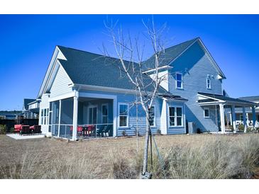 Two-story house with screened porch and landscaped yard at 1573 Trailmore Ln, Summerville, SC 29486