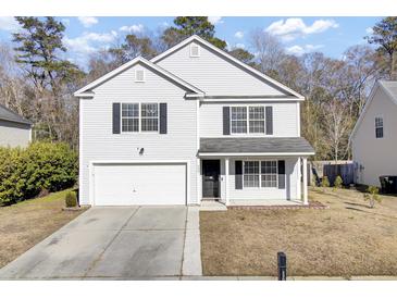 Two-story house with white siding, black shutters, and a two-car garage at 230 Eagle Ridge Rd, Summerville, SC 29485