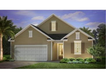 Two-story house with neutral siding, white garage door, and landscaping at 382 Willows Crescent Dr, Moncks Corner, SC 29461