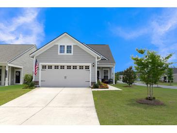 Gray house with a two-car garage and landscaped lawn at 455 Switchgrass Dr, Summerville, SC 29486