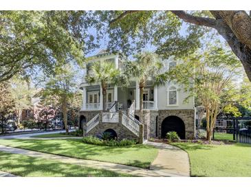 Two-story house with a large front porch and landscaped yard at 400 Bay Crossing Rd, Mount Pleasant, SC 29464