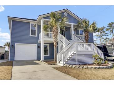 Two-story house with gray siding, white trim, and a large front porch at 1201 Roma Rd, Hanahan, SC 29410