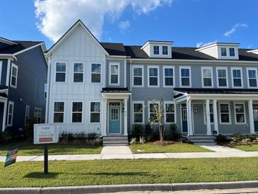 Two-story townhouses with gray siding and white accents at 191 Blueway Ave, Summerville, SC 29486