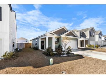Charming craftsman style home with a well-manicured lawn and attached garage at 115 Holly Leaf Ln, Summerville, SC 29486