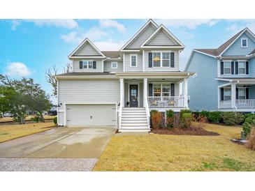 Two-story house with gray siding, white trim, and a front porch at 2186 Midden Dr, Mount Pleasant, SC 29466