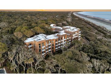 Aerial view of coastal community with oceanfront homes and lush landscaping at 2371 Shipwatch Rd, Kiawah Island, SC 29455