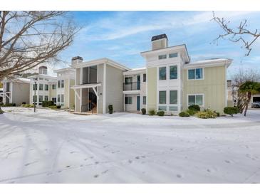 Snow covered exterior of modern condo building with light-colored siding at 267 Alexandra # 6, Mount Pleasant, SC 29464