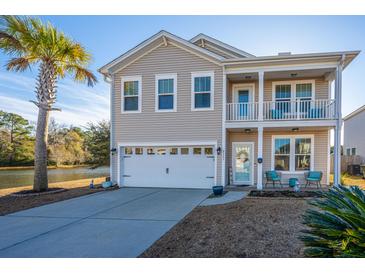 Two-story house with a two-car garage and water view at 3157 Timberline Dr, Johns Island, SC 29455