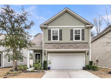 Beautiful two-story home with a gray exterior and a white garage door at 3765 Sawmill Ct, Mount Pleasant, SC 29429