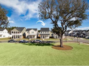 Two-story house in a neighborhood with a grassy yard at 117 Wonder Sol Way, Summerville, SC 29485