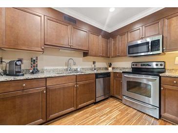 Modern kitchen with stainless steel appliances and granite countertops at 1240 Fairmont Ave # 1, Mount Pleasant, SC 29464