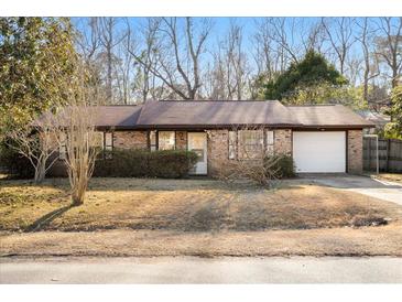 Brick ranch house with attached garage and landscaping at 116 Eagle Dr, Summerville, SC 29485