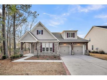 Craftsman style home with stone accents and a two-car garage at 226 Comiskey Park Cir, Summerville, SC 29485