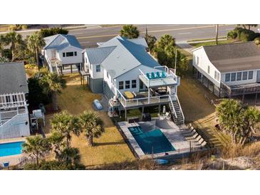 Aerial view of beach house with pool and ocean access at 1306 Palmetto Blvd, Edisto Beach, SC 29438